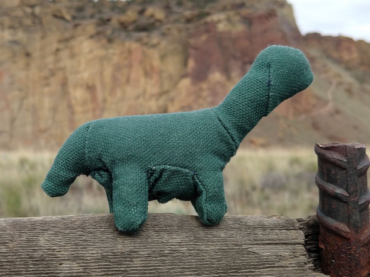 a little green apatosaurus plushie